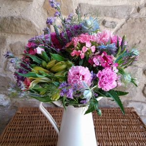 A 'Cornish Flowers - Mixed Bunch' featuring Scented Pinks, Alstroemeria, Statice and Nigella. Fresh Cut flowers. Vase not included.