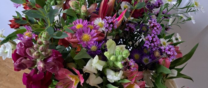 A Hand-Tied Bouquet close up from late October - featuring Cornish Alstroemeria, Snapdragons, Michaelmas Daisies, Verbena Bonariensis and lovely fresh foliage.