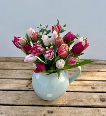 A bunch of Pink Tulips in multiple shades of Pink, featuring multiple varieties. Vase not included.