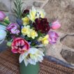 Close up of a Spring Posy of yellow Narcissi, Sweet William in mixed colours, blue Scillas and mixed colour Tulips. Vase not included.